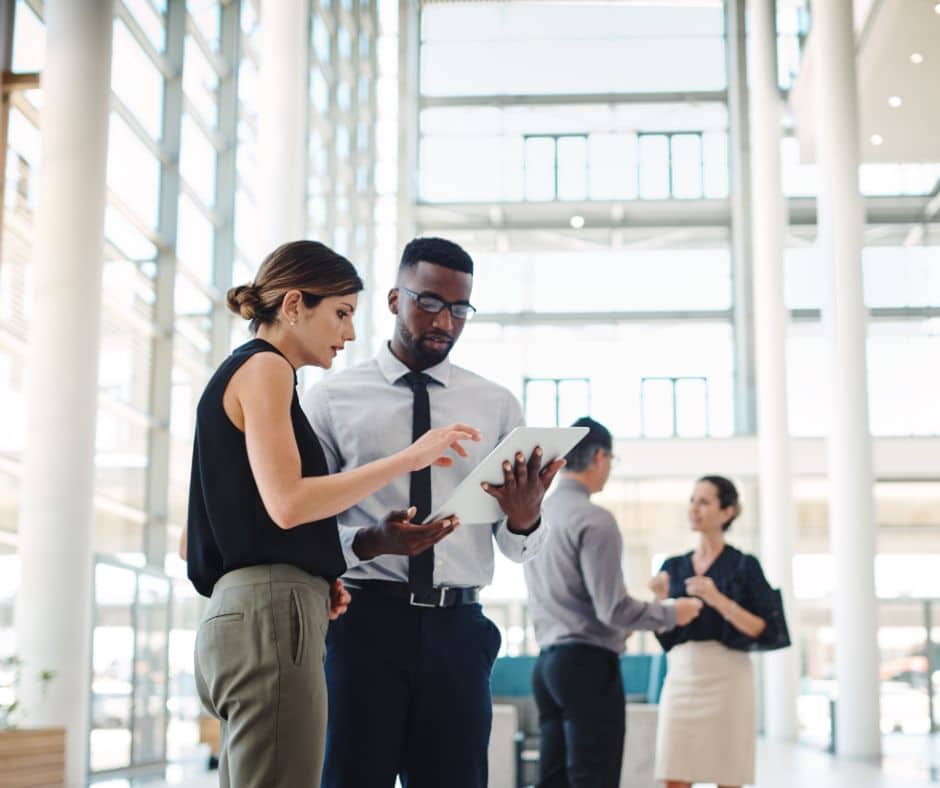 two employees going over a document
